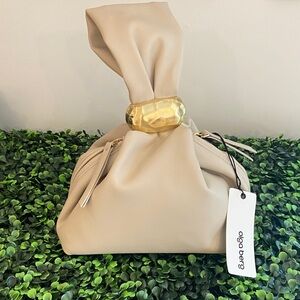 Olga Berg Cream Knot-Top Wrist Clutch with Gold Accent